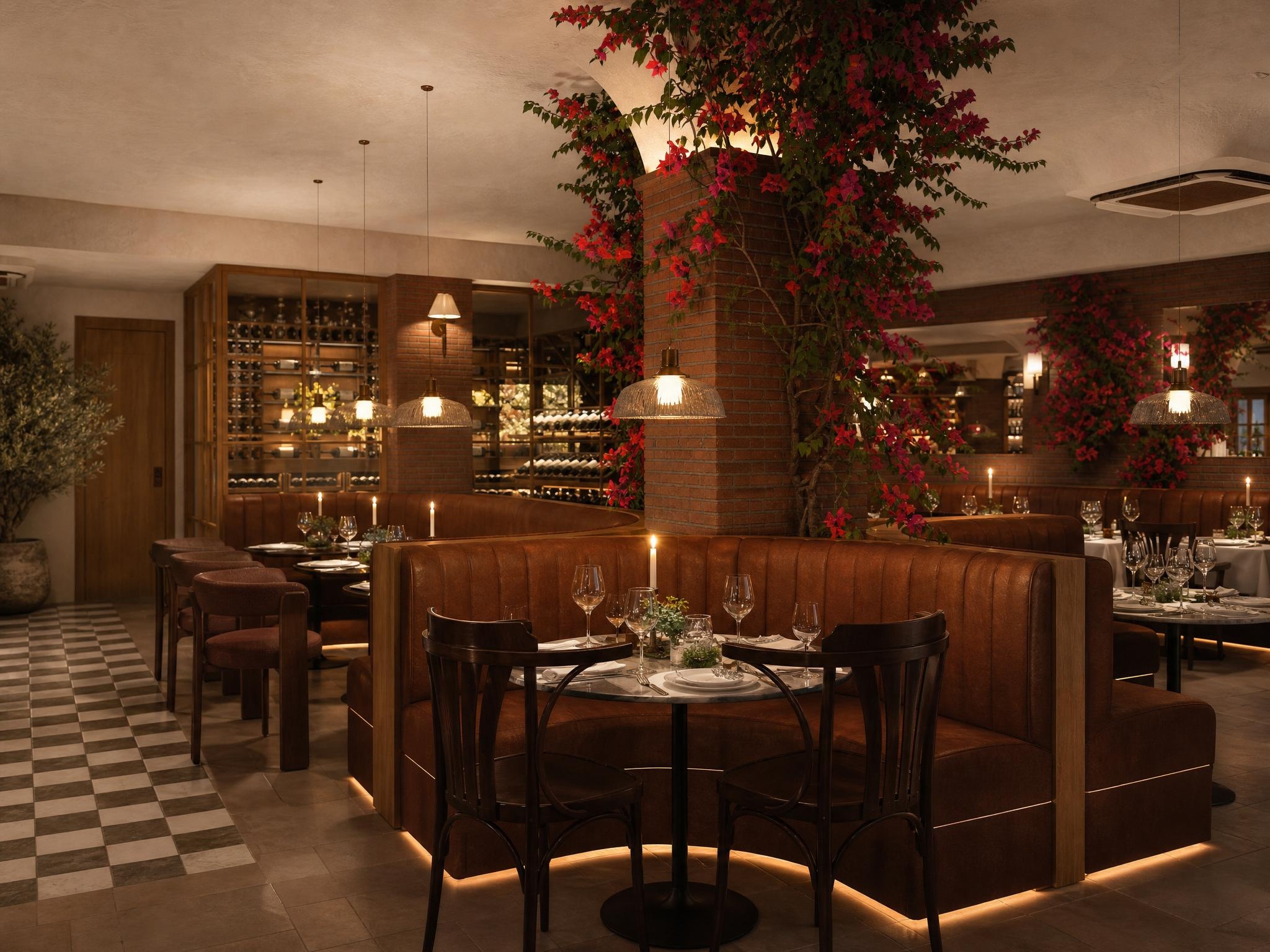 The Nonna's dining room, oxblood leather booths, checkered marble floor, bougainvillea spilling from a central column, wine wall behind